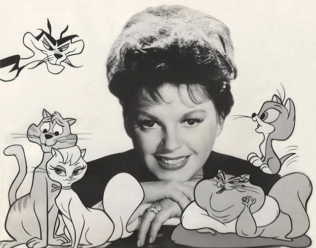 Gay Purr-ee - Judy Garland posing with cast of cartoon cats