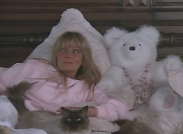 Ghosts Can't Do It - Katie Bo Derek lying on bed with Himalayan cat
