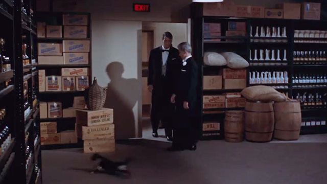 Giant - tuxedo cat running across floor in front of Bick Rock Hudson and Jett James Dean