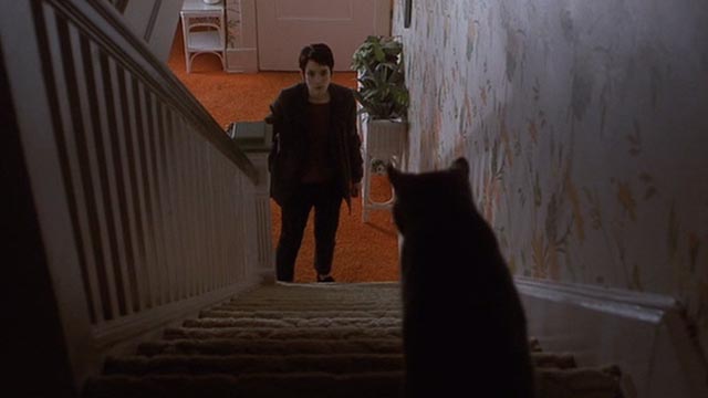 Girl, Interrupted - Ruby gray cat at top of stairs looking down at Susanna Winona Ryder