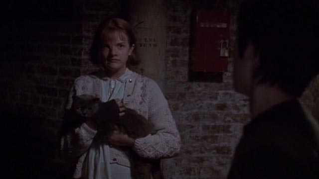 Girl, Interrupted - Susanna Winona Ryder with Polly Elizabeth Moss holding Ruby gray cat closer