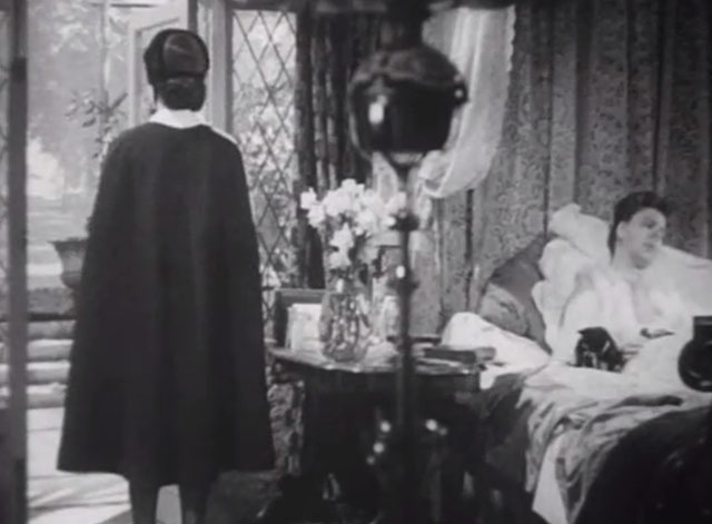 The Girl in the News - tuxedo kitten on bed with Miss Blakely Irene Handl with Nurse Graham Margaret Lockwood