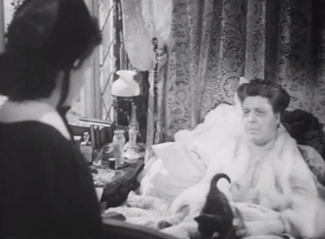 The Girl in the News - tuxedo kitten on bed with Miss Blakely Irene Handl with Nurse Graham Margaret Lockwood