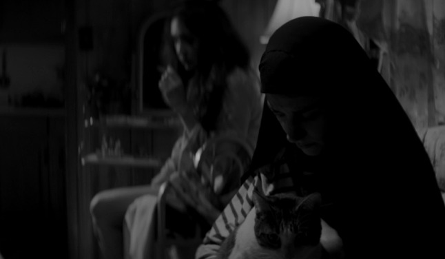 A Girl Walks Home Alone at Night - Masuka cat being held by The Girl