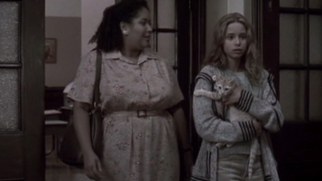 Glitter - young Billie Isabel Gomes with tabby kitten Whisper entering children's home