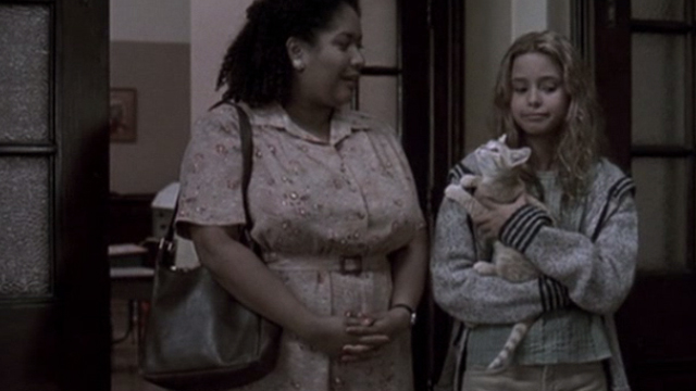 Glitter - young Billie Isabel Gomes with tabby kitten Whisper entering children's home