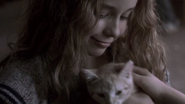 Glitter - young Billie Isabel Gomes with tabby kitten Whisper being petted