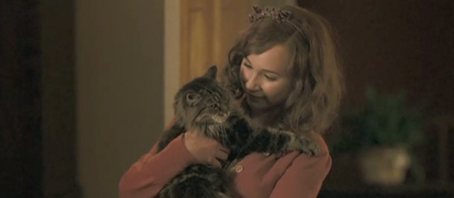 Glorious 39 - Celia Juno Temple holding long haired tabby cat Sonia