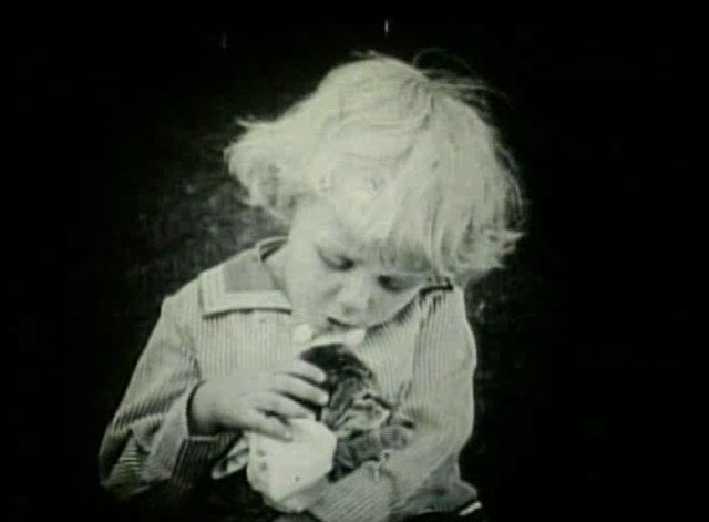 Going Straight - Francis Carpenter playing with small tabby cat
