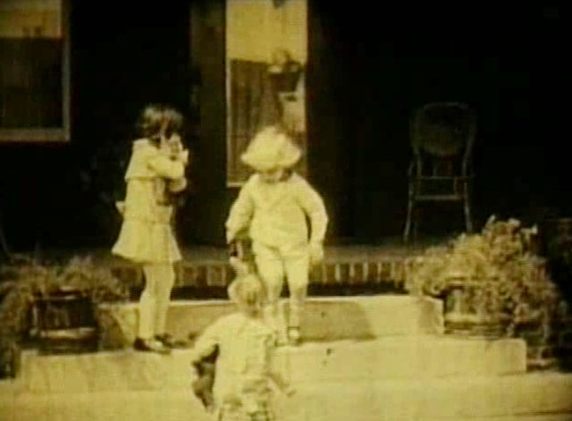 Going Straight - kids Violet Radcliffe holding tabby cat with 'Baby' Carmen De Rue