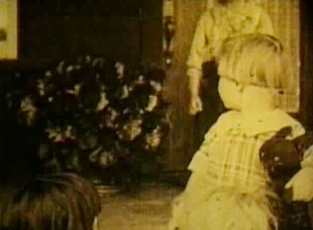 Going Straight - 'Baby' Carmen De Rue holding stuffed black cat toy