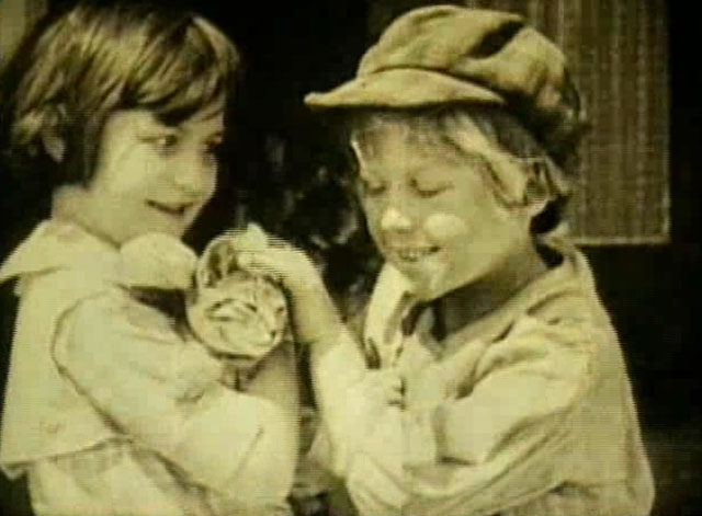 Going Straight - Violet Radcliffe holding tabby cat with waif Georgie Stone