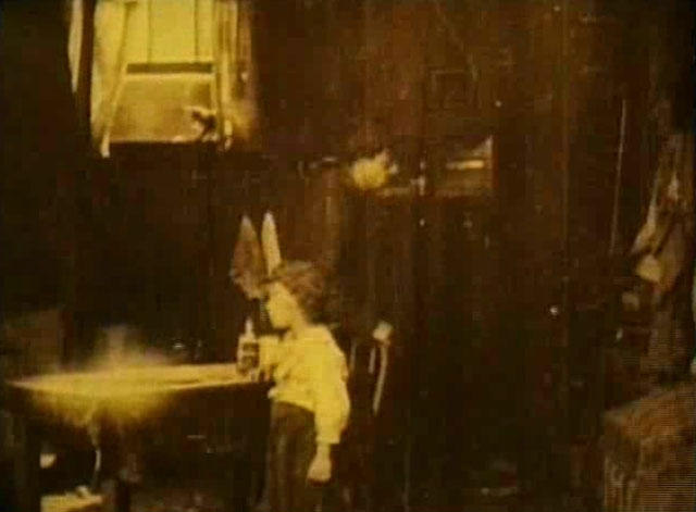 Going Straight - the Waif Georgie Stone sitting in dark shabby room with small cat sitting in window