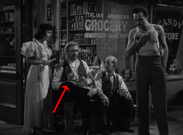 Golden Boy - tabby cat on lap of Mr. Bonaparte Lee J. Cobb outside store