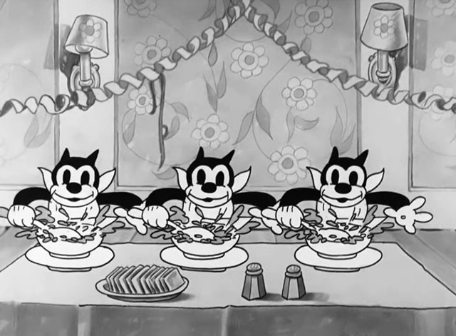 Goopy Geer - three cartoon black cats with soup bowls