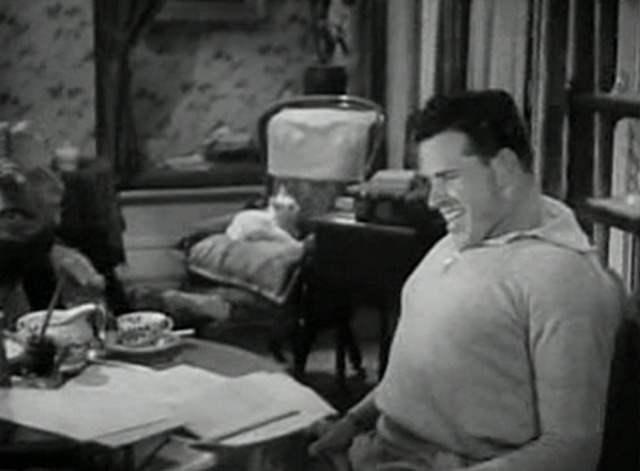 Grand Old Girl - white cat Tom sitting in chair in background