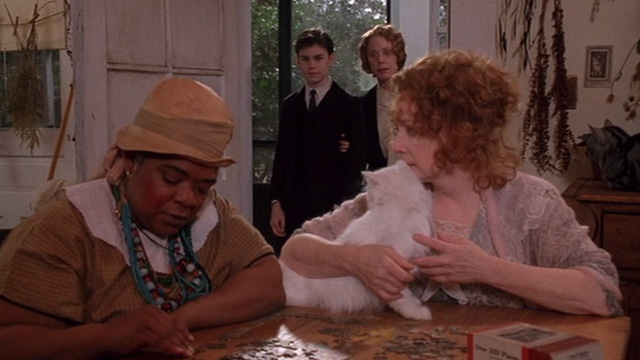 The Grass Harp - Dolly Piper Laurie with long haired white cat on table and Bengal tabby behind with Catherine Nell Carter and Collin Edward Furlong and Verena Sissy Spacek in background
