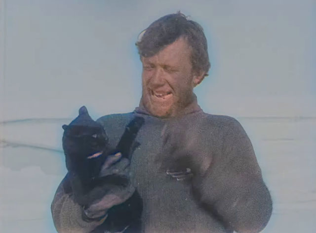 The Great White Silence - black cat in arms of sailor Lees from Terra Nova