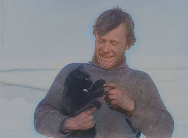 The Great White Silence - black cat in arms of sailor Lees from Terra Nova