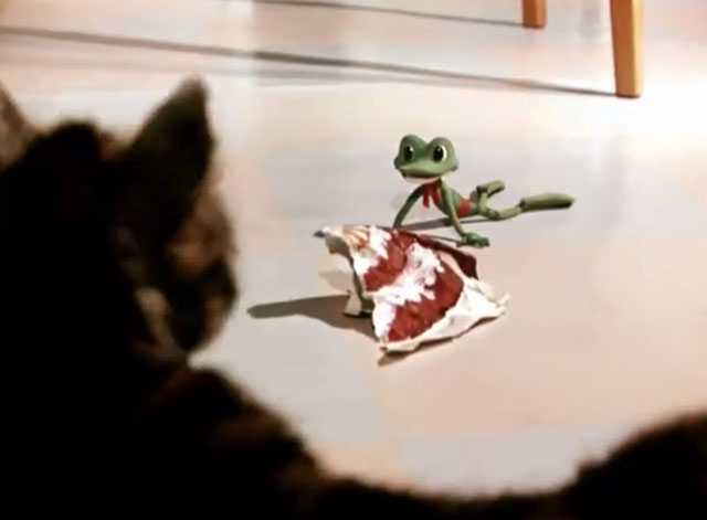 Greedy Kuzya - frog trying to steal birthday cake photo from brown and white tabby cat Kuzya