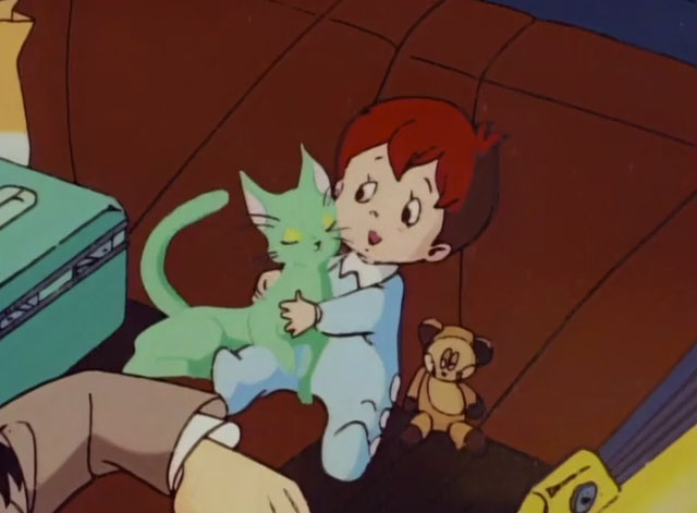 The Green Cat - Midori no neko - infant Sango in back seat of car with cartoon green cat in arms