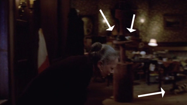 Gremlins - cats in background behind Mrs. Deagle as she stumbles to chair