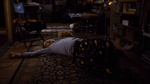 Hamlet 2 - orange and white cat sitting beside prone Dana Marschz Steve Coogan