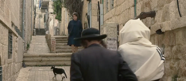 Hannah Arendt - tuxedo cat walking on Jerusalem street with rabbis and Hannah Barbara Sukowa