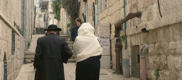 Hannah Arendt - tuxedo cat walking on Jerusalem street with rabbis and Hannah Barbara Sukowa
