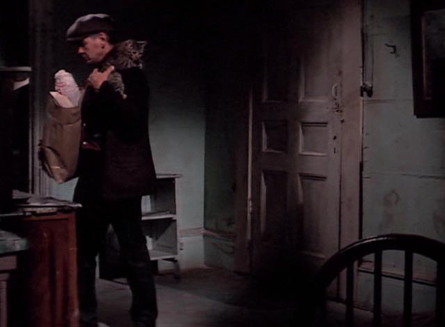 Hard Times - Chaney Charles Bronson holding tabby cat while unloading groceries long shot