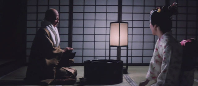 The Haunted Castle - Hiroku kaibyô-den - Matashichiro Ryuzoji Akihisa Toda holding black cat Tama in lap with Sayo Mitsuyo Kamei