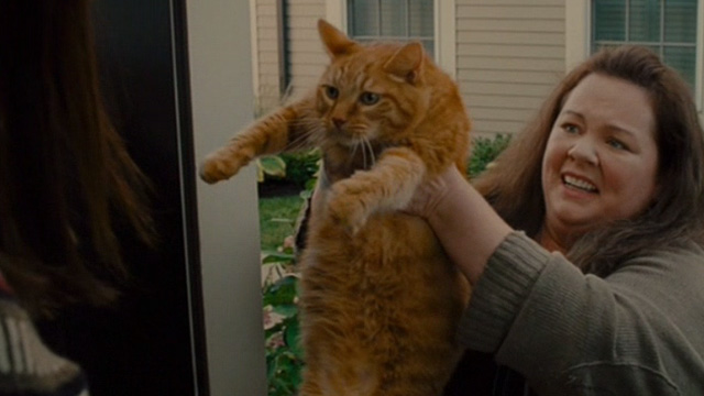The Heat - Mullins Melissa McCarthy holding up orange tabby cat Pumpkin