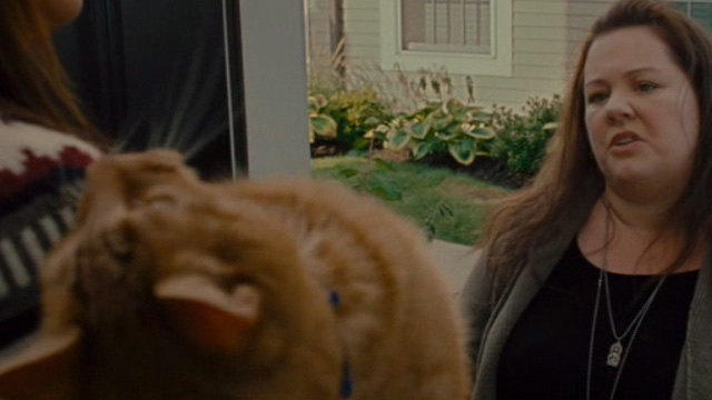 The Heat - Mullins Melissa McCarthy looking at orange tabby cat Pumpkin