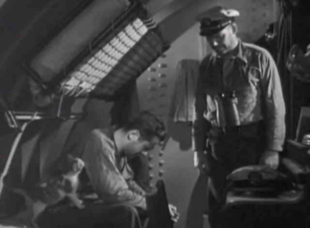 Hell Below - Robert Montgomery on bunk with calico cat and Walter Huston