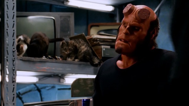 Hellboy - Ron Perlman Hellboy with cats in background