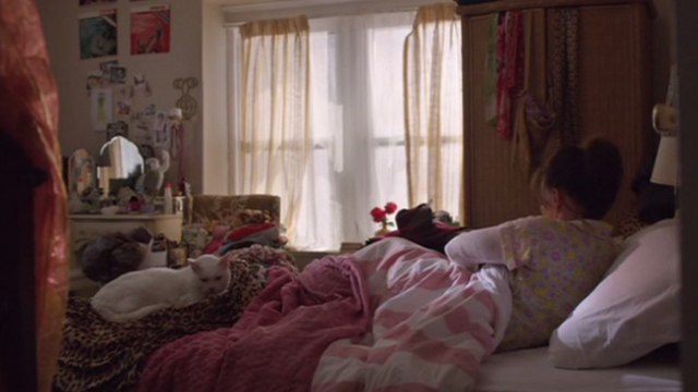 Hello My Name is Doris - white cat lying on bed with Doris Sally Field