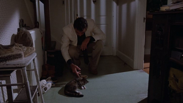 Her Alibi - Phil Blackwood Tom Selleck with small tabby cat Beeswax lying on floor