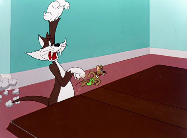 A Hick, a Slick and a Chick - cartoon mouse Elmo dodging brown and white cat Herman who raises paw