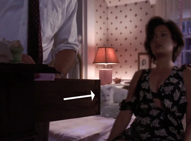 High School High - white cat sitting on bed behind Victoria Tia Carrere