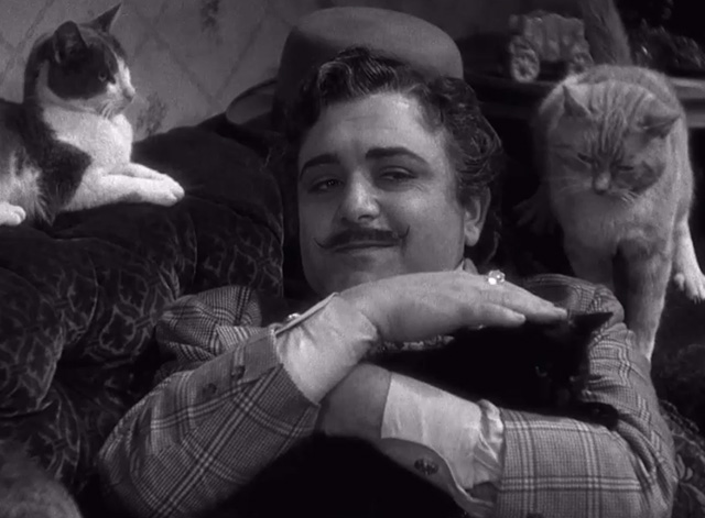 High, Wide and Handsome - Joe Varese Akim Tamiroff petting black cat and lying on couch with tuxedo and tabby cats
