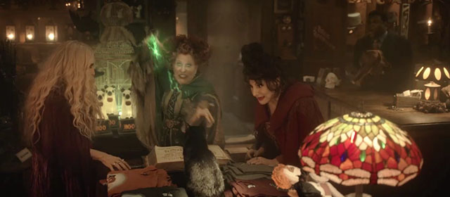 Hocus Pocus 2 - black cat Cobweb about to be zapped by the Sanderson Sisters Bette Midler, Kathy Najimy and Sarah Jessica Parker with Gilbert Sam Richardson