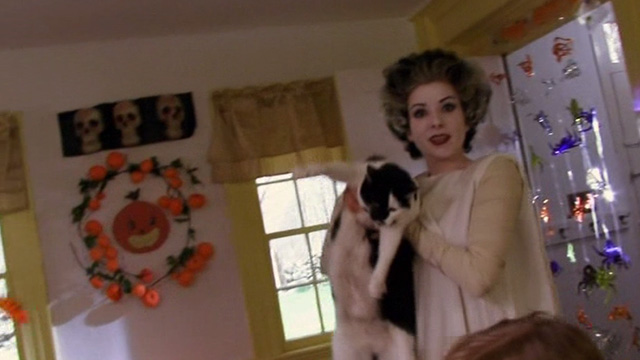Home Movie - Clare Cady McClain dressed as bride of Frankenstein holding tuxedo cat