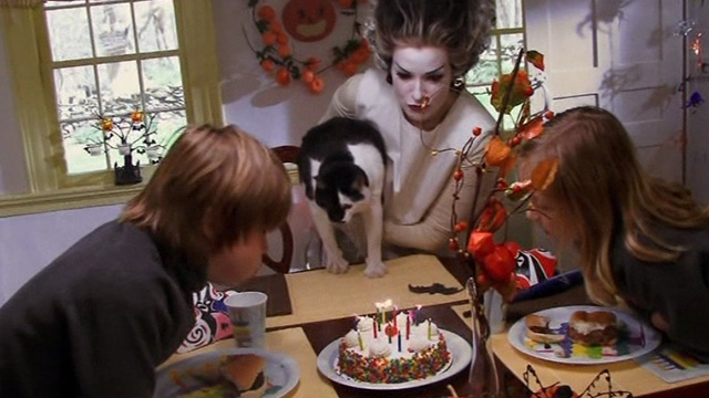 Home Movie - Clare Cady McClain dressed as bride of Frankenstein holding tuxedo cat over birthday cake with Jack Austin Williams and Emily Amber Joy Williams