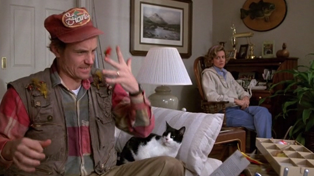 Honey, I Shrunk the Kids - tuxedo cat Spike sitting beside Russ Matt Frewer waving hand on couch