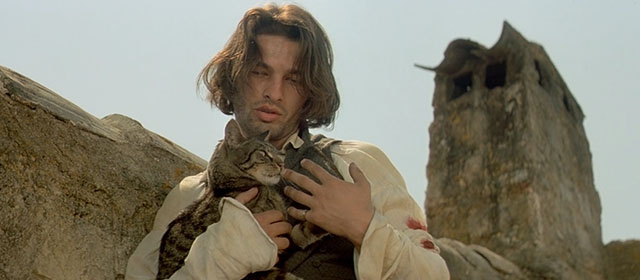 Le Hussard sur le Toit - The Horseman on the Roof - brown tabby cat in the arms of Angelo Olivier Martinez