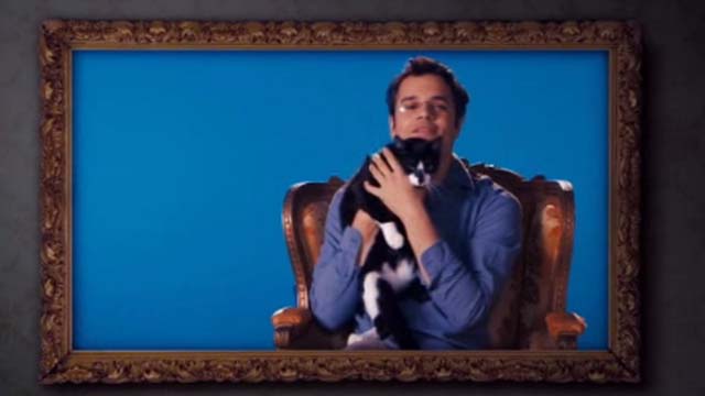 Hotel for Dogs - crew member holding pet tuxedo cat