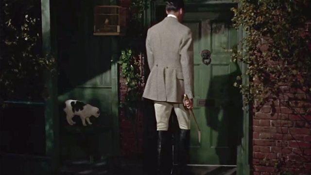 The Hound of the Baskervilles - white cat with black markings near Sir Henry Christopher Lee at front door