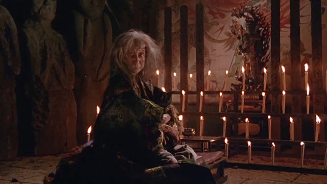The House Where Evil Dwells - old witch Tsuyako Okajima with black cat in arms