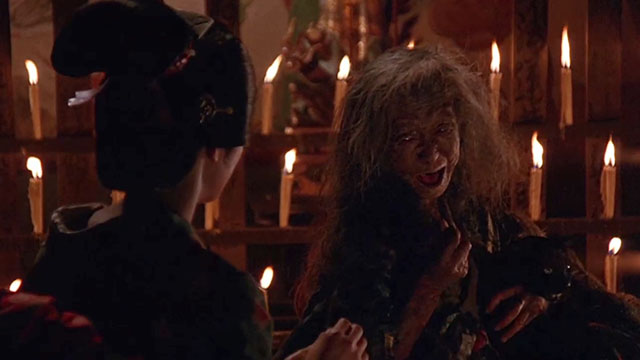 The House Where Evil Dwells - Otami Mako Hattori with old witch Tsuyako Okajima holding black cat in arms