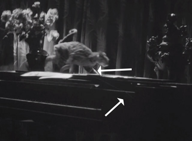 The House of Fear - tabby cat running from vase of flowers on piano with wire showing